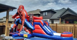 Spiderman themed inflatable bounce house with slide