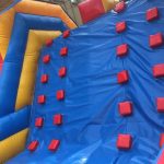 Bounce house with attached climbing wall